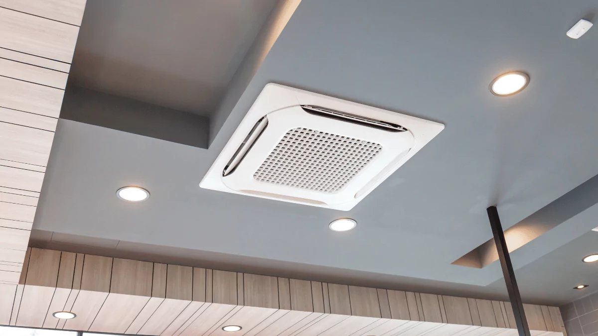 a ceiling mounted air conditioner in a room
