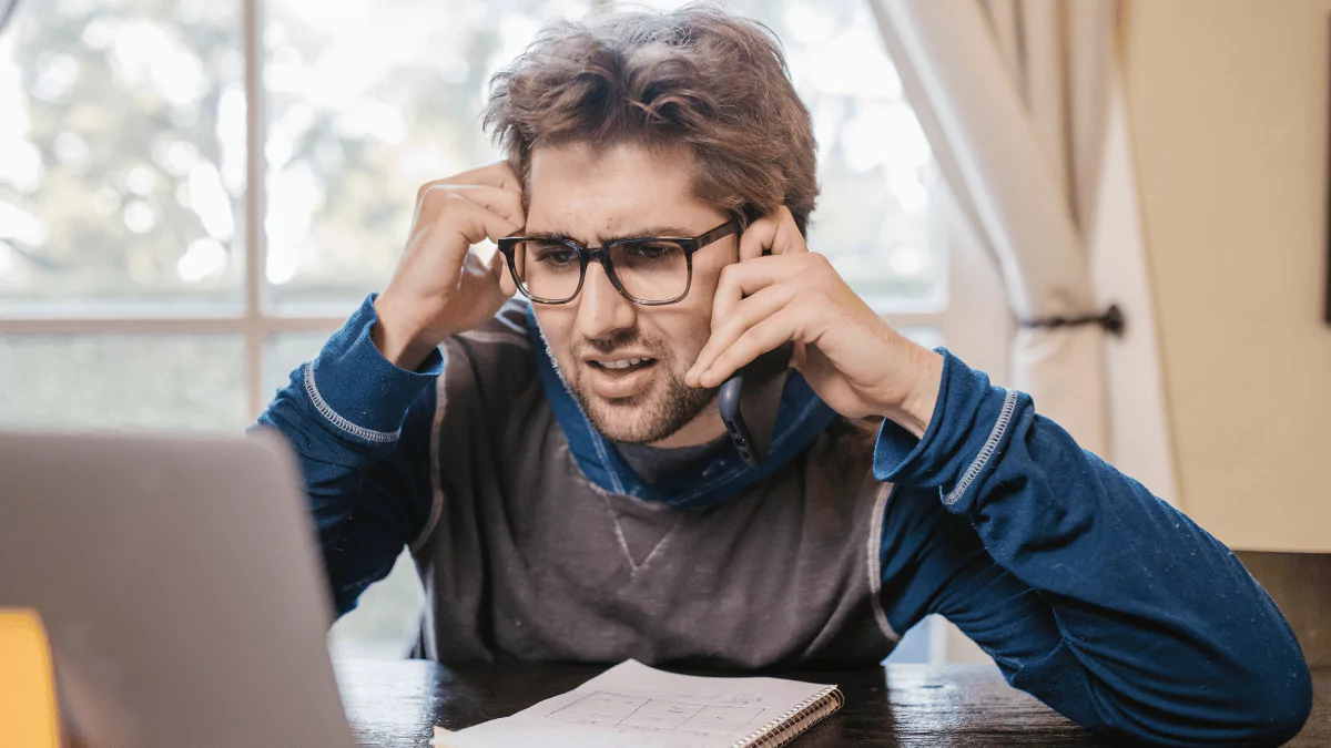 Confused Man Looking at the Laptop Screen