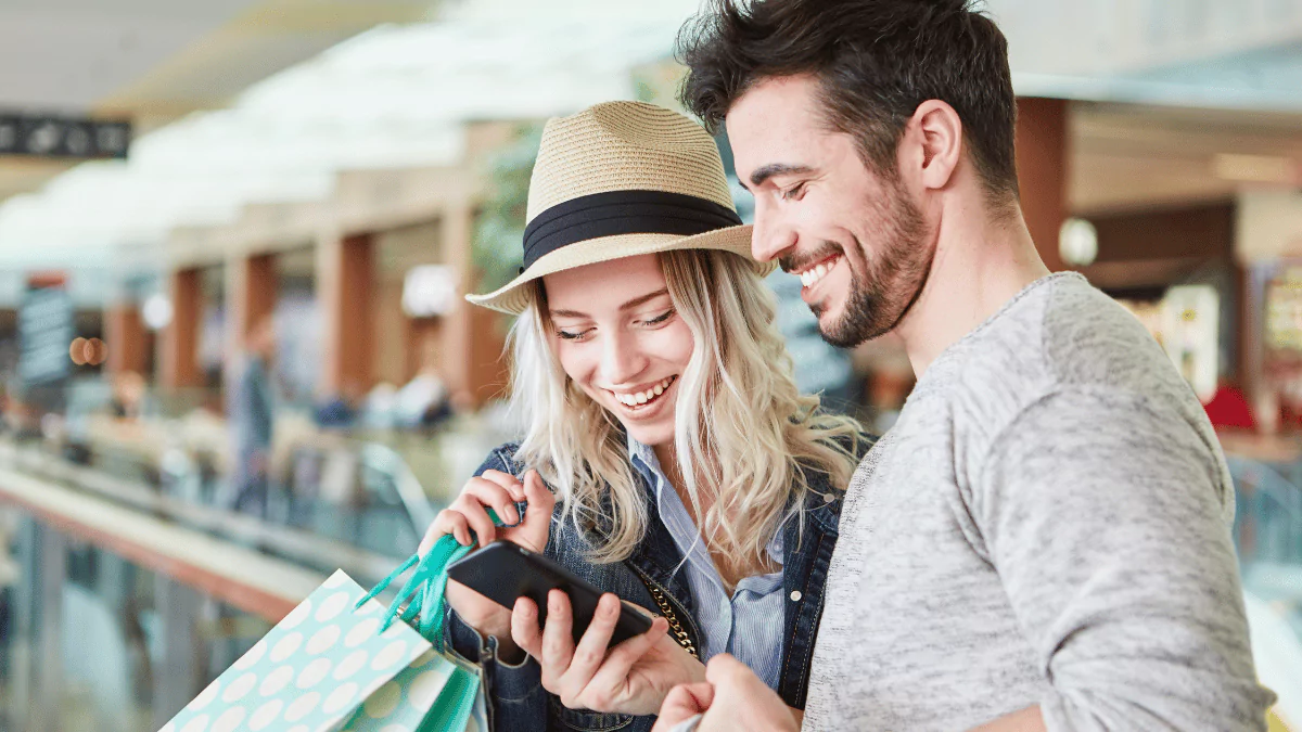 Shopper using a digital coupon app in a grocery store