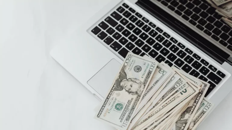 close-up-photo-of-banknotes-on-top-of-a-laptops-keyboard